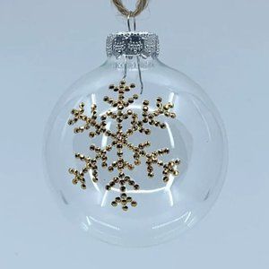 Round plastic Christmas ornament. Handmade gold rhinestone snowflake design.